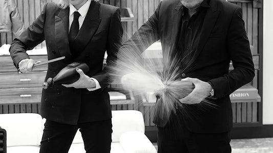 Sabering a personalized COUP champagne bottle as part of an executive gift experience and celebratory moment